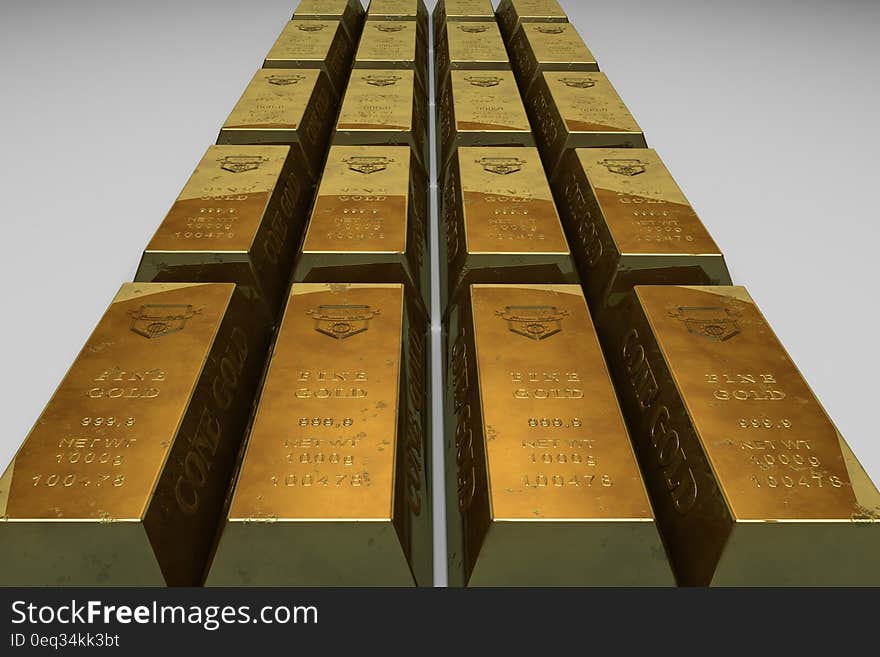 Shallow Focus Photo of Gold Bars