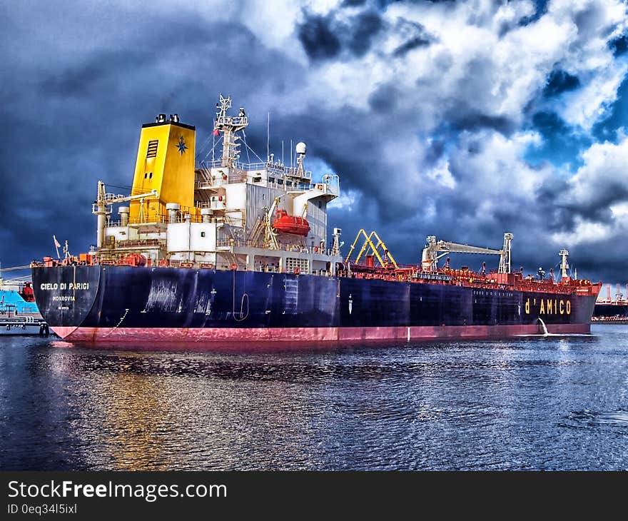 Blue and Grey Cargo Ship Navigating