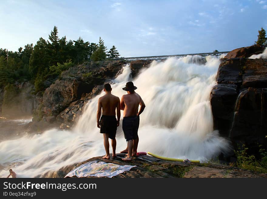 Young people having fun near waterfall. Young people having fun near waterfall