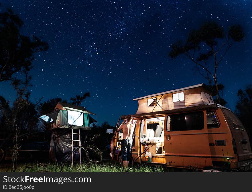 A motor home opened in a camping site. A motor home opened in a camping site