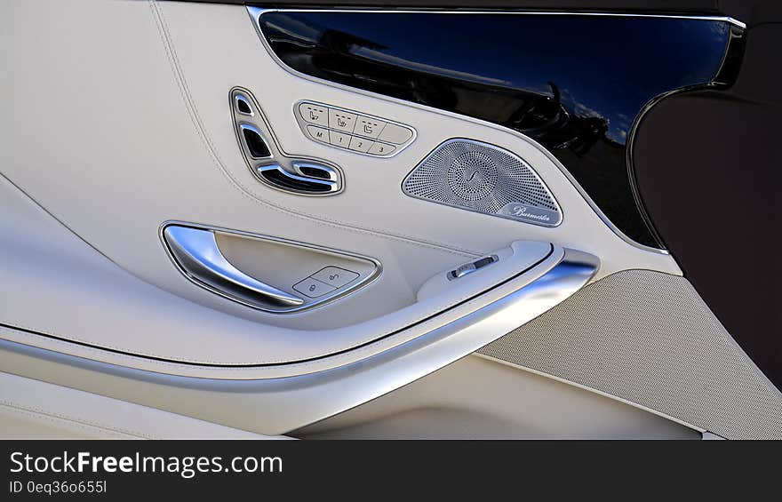 Vehicle interior with door controls. Vehicle interior with door controls