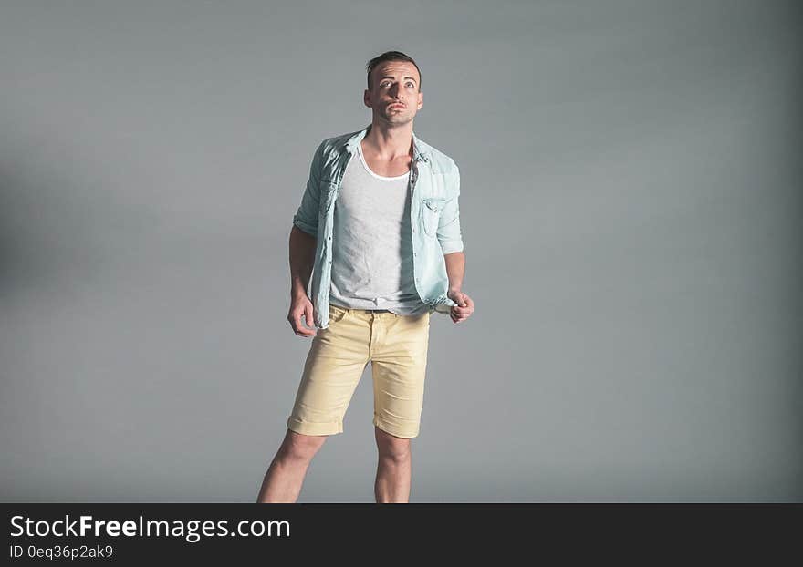 Young man looking up in studio