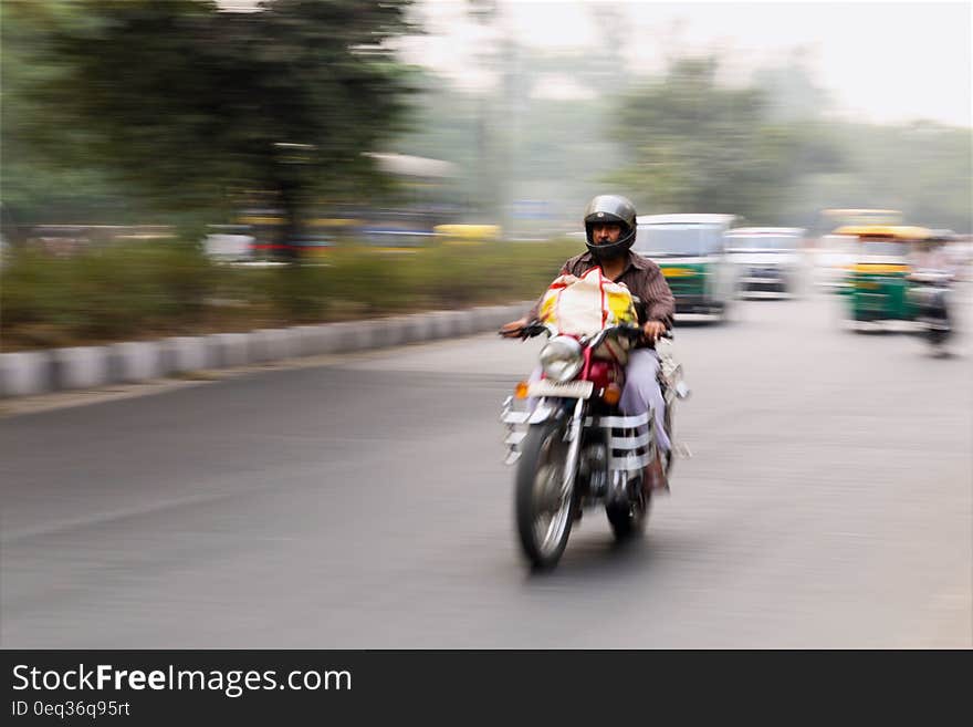 Man Riding on Motorcycle