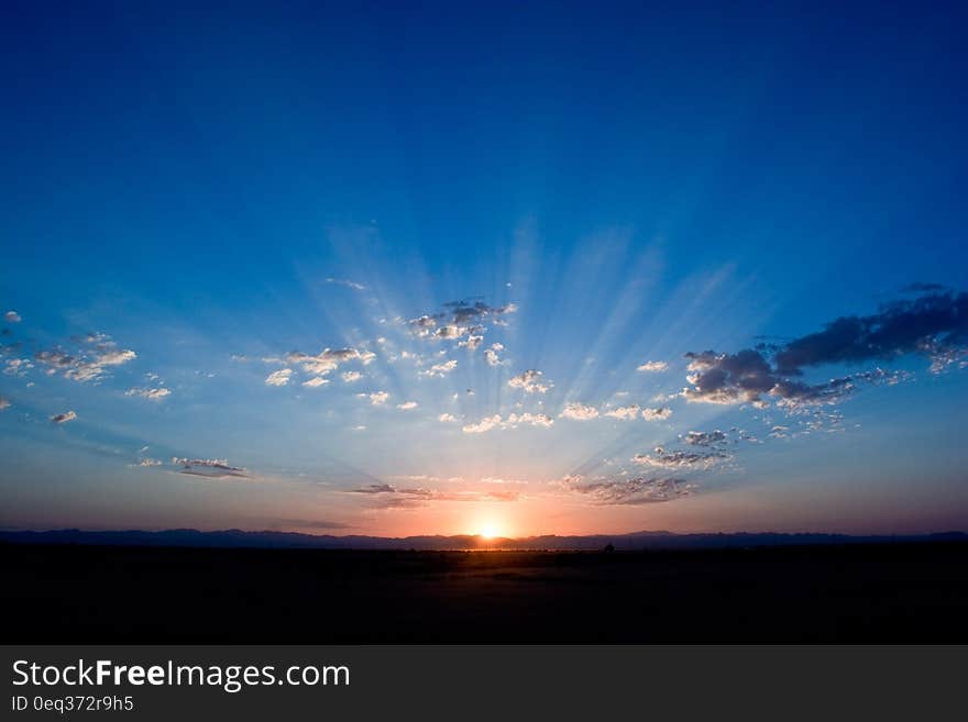 Sunrise Under Cloudy Sky Illustration