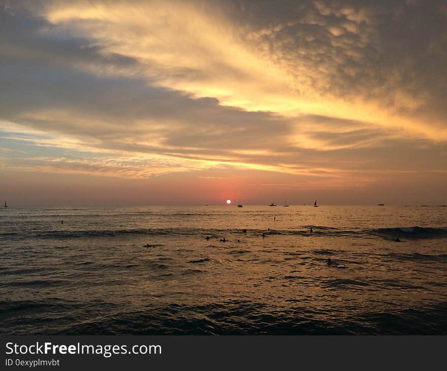 Sunset above Pacific Ocean - View from Waikiki Wall in Honolulu on Oahu Island, Hawaii.