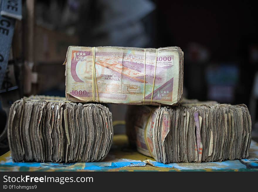 Bundles of Somali shilling notes are seen at a money exchangers stall on the streets of the Somali capital Mogadishu. Millions of people in the Horn of Africa nation Somalia rely on money sent from their relatives and friends abroad in the form of remittances in order to survive, but it is feared that a decision by Barclays Bank to close the accounts of some of the biggest Somali money transfer firms – due to be announced this week - will have a devastating effect on the country and its people. According to the United Nations Development Programme &#x28;UNDP&#x29;, an estimated $1.6 billion US dollars is sent back annually by Somalis living in Europe and North America. Some money transfer companies in Somalia have been accused of being used by pirates to launder money received form ransoms as well as used by Al Qaeda-affiliated extremist group al Shabaab group to fund their terrorist activities and operations in Somalia and the wider East African region. AU/UN IST PHOTO / STUART PRICE. Bundles of Somali shilling notes are seen at a money exchangers stall on the streets of the Somali capital Mogadishu. Millions of people in the Horn of Africa nation Somalia rely on money sent from their relatives and friends abroad in the form of remittances in order to survive, but it is feared that a decision by Barclays Bank to close the accounts of some of the biggest Somali money transfer firms – due to be announced this week - will have a devastating effect on the country and its people. According to the United Nations Development Programme &#x28;UNDP&#x29;, an estimated $1.6 billion US dollars is sent back annually by Somalis living in Europe and North America. Some money transfer companies in Somalia have been accused of being used by pirates to launder money received form ransoms as well as used by Al Qaeda-affiliated extremist group al Shabaab group to fund their terrorist activities and operations in Somalia and the wider East African region. AU/UN IST PHOTO / STUART PRICE.