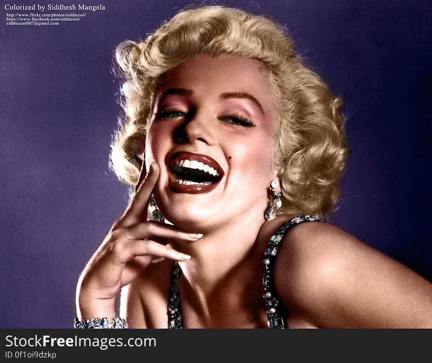 Portrait of Marilyn Monroe on purple background.