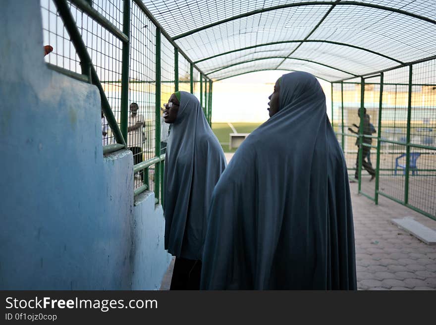 Two medics speak to fans sitting in the stands after the end of a football match between the Somali Police Force and the Somali National Army in Mogadishu on January 31. AU UN IST PHOTO / Tobin Jones. Two medics speak to fans sitting in the stands after the end of a football match between the Somali Police Force and the Somali National Army in Mogadishu on January 31. AU UN IST PHOTO / Tobin Jones