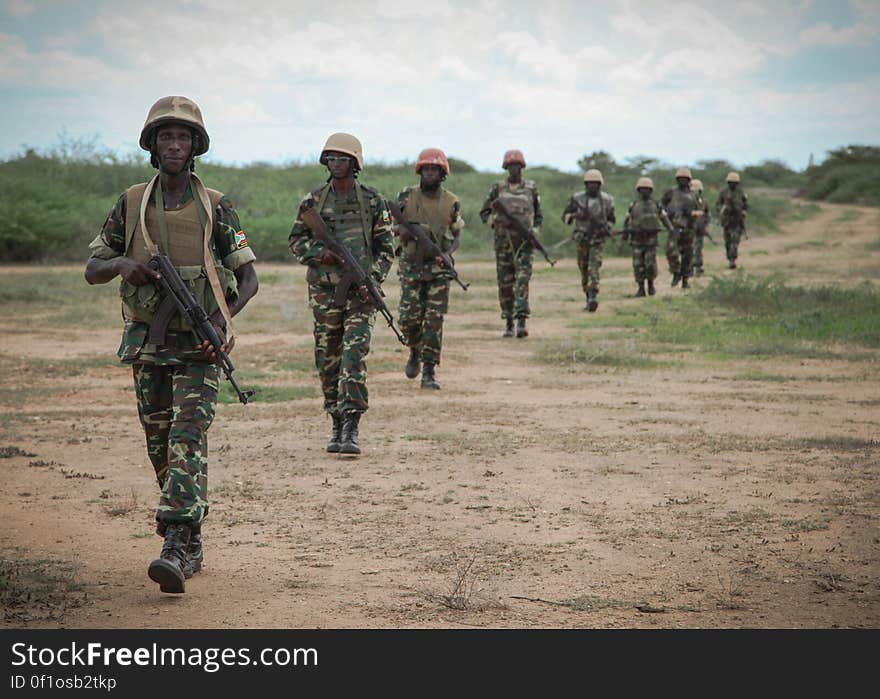 Burundian troops serving with the African Union Mission in Somalia &#x28;AMISOM&#x29; patrol near the village of Modmoday approx. 40km east of the central Somali town of Baidoa. The Burundians, together with forces of the Somali National Army &#x28;SNA&#x29; have been mounting &#x27;snap&#x27; foot patrols in villages and areas to the east of Baidoa where Al Qaeda-affiliated extremist group Al Shabaab mount attacks against local herdsmen, villages and travelers along the busy Baidoa-Mogadishu road. The AMISOM troops also use the patrols as an opportunity to provide occasional free medical treatment and fresh, potable drinking water for residents in the area. AU/UN IST PHOTO / ABDI DAKAN. Burundian troops serving with the African Union Mission in Somalia &#x28;AMISOM&#x29; patrol near the village of Modmoday approx. 40km east of the central Somali town of Baidoa. The Burundians, together with forces of the Somali National Army &#x28;SNA&#x29; have been mounting &#x27;snap&#x27; foot patrols in villages and areas to the east of Baidoa where Al Qaeda-affiliated extremist group Al Shabaab mount attacks against local herdsmen, villages and travelers along the busy Baidoa-Mogadishu road. The AMISOM troops also use the patrols as an opportunity to provide occasional free medical treatment and fresh, potable drinking water for residents in the area. AU/UN IST PHOTO / ABDI DAKAN.