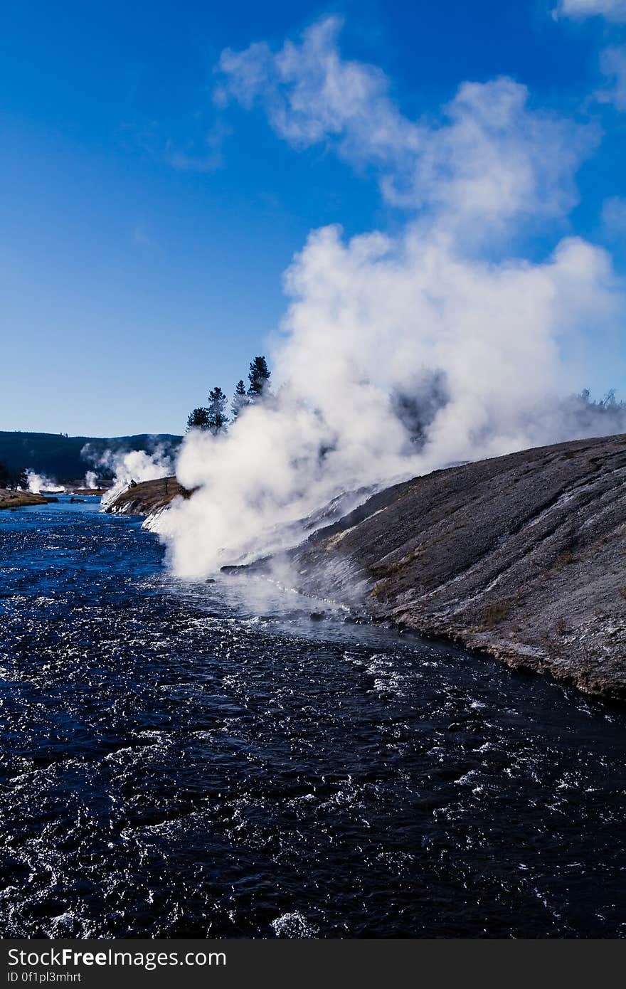 The Firehole River in Yellowstone National Park, Wyoming. To the right is the runoff from Excelsior Geyser into the river. en.wikipedia.org/wiki/Firehole_River en.wikipedia.org/wiki/Excelsior_Geyser More photos are here: www.flickr.com/photos/thadz/albums/72157660032324601