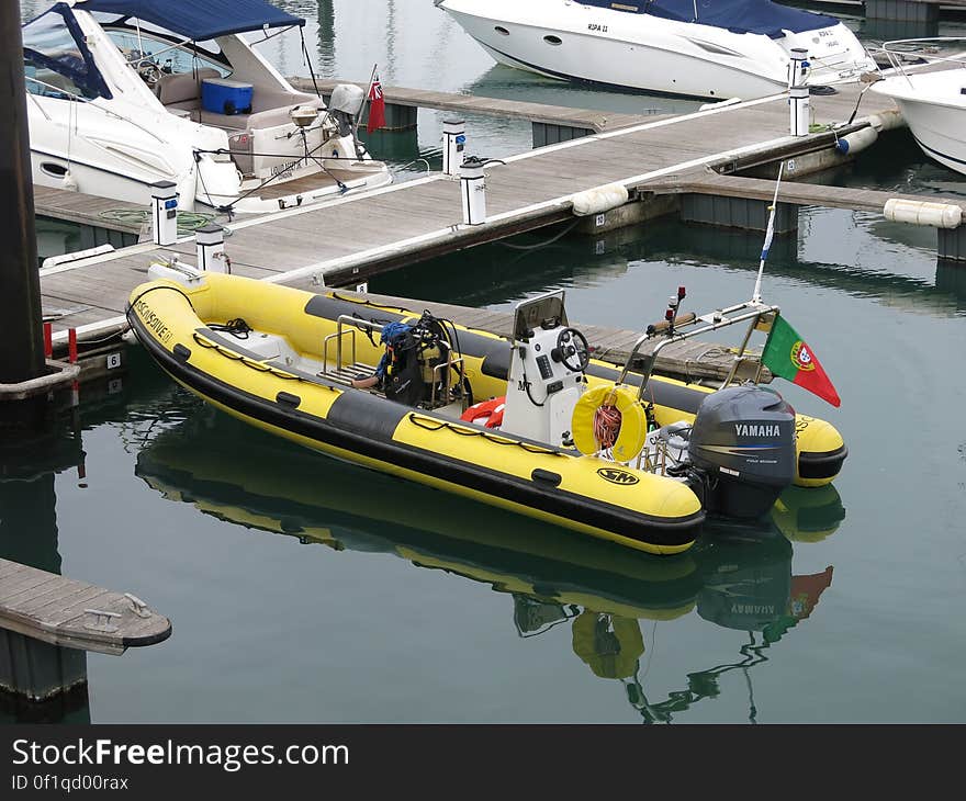 Various boats and raft at modern dock. Various boats and raft at modern dock.