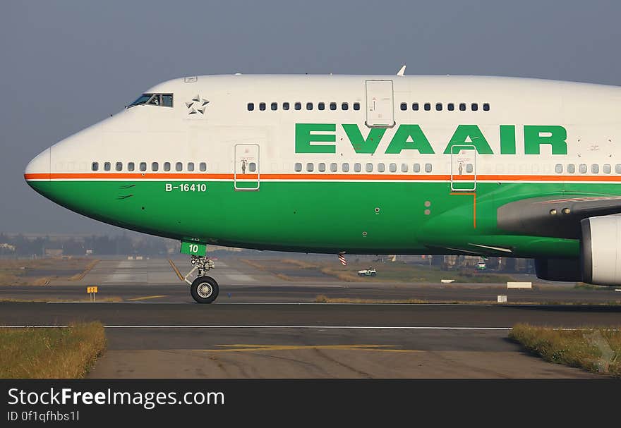 Nose of Eva Air airliner taxiing on runway on sunny day. Nose of Eva Air airliner taxiing on runway on sunny day.