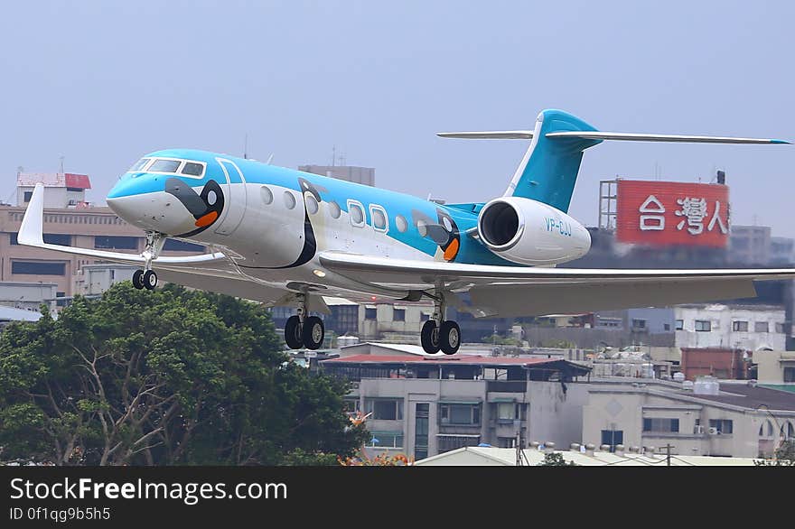 Commercial airliner on take-off or descent over urban neighborhood in daytime. Commercial airliner on take-off or descent over urban neighborhood in daytime.