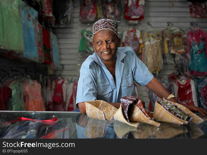 A shopkeeper is seen in a clothing and footwear shop in Hamar Weyne market in the Somali capital Mogadishu, 05 August, 2013. 06 August marks 2 years since the Al Qaeda-affiliated extremist group Al Shabaab withdrew from Mogadishu following sustained operations by forces of the Somali National Army &#x28;SNA&#x29; backed by troops of the African Union Mission in Somalia &#x28;AMISOM&#x29; to retake the city. Since the group&#x27;s departure the country&#x27;s captial has re-established itself and a sense of normality has returned. Buildings and infrastructure devastated and destroyed by two decades of conflict have been repaired; thousands of Diaspora Somalis have returned home to invest and help rebuild their nation; foreign embassies and diplomatic missions have reopened and for the first time in many years, Somalia has an internationally recognised government.. AU-UN IST PHOTO / STUART PRICE. A shopkeeper is seen in a clothing and footwear shop in Hamar Weyne market in the Somali capital Mogadishu, 05 August, 2013. 06 August marks 2 years since the Al Qaeda-affiliated extremist group Al Shabaab withdrew from Mogadishu following sustained operations by forces of the Somali National Army &#x28;SNA&#x29; backed by troops of the African Union Mission in Somalia &#x28;AMISOM&#x29; to retake the city. Since the group&#x27;s departure the country&#x27;s captial has re-established itself and a sense of normality has returned. Buildings and infrastructure devastated and destroyed by two decades of conflict have been repaired; thousands of Diaspora Somalis have returned home to invest and help rebuild their nation; foreign embassies and diplomatic missions have reopened and for the first time in many years, Somalia has an internationally recognised government.. AU-UN IST PHOTO / STUART PRICE.