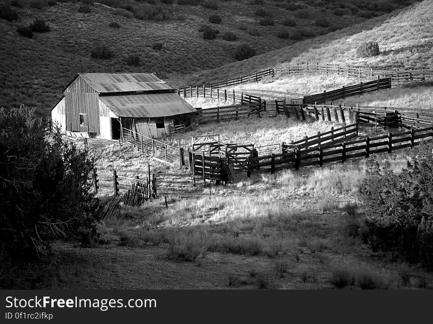 Gray Scale Photo of House on Field