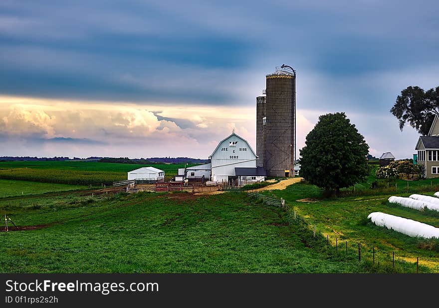 Scenic View of Landscape Against Cloudy Sky