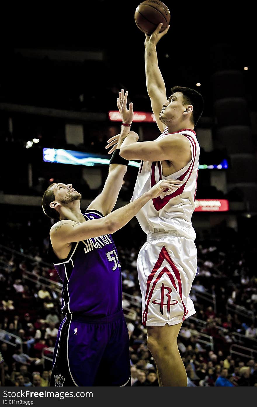 Yao Ming Holding Basketball on His Left Hand While Jumping