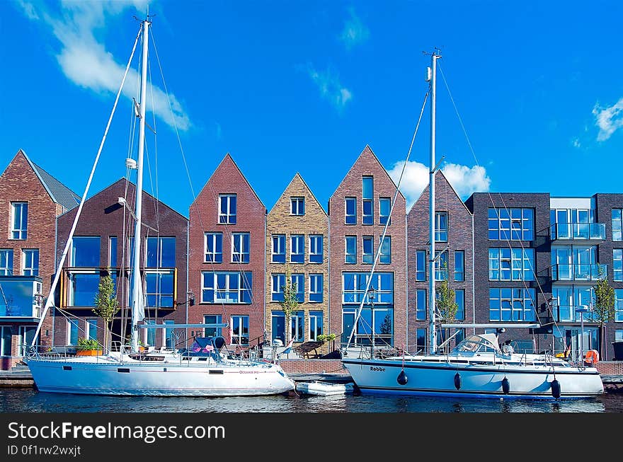 A view of a town with old brick houses at the harbor. A view of a town with old brick houses at the harbor.