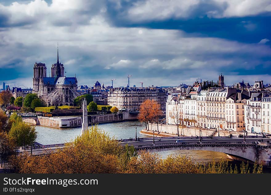 View of Cityscape Against Cloudy Sky