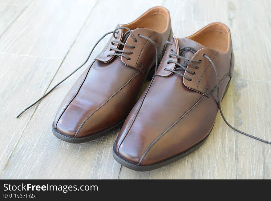 A pair of men's shoes with brown leather. A pair of men's shoes with brown leather.