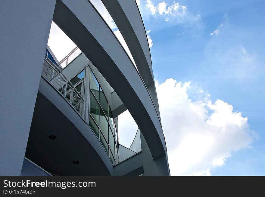 A closeup of a modern building with round structures. A closeup of a modern building with round structures.