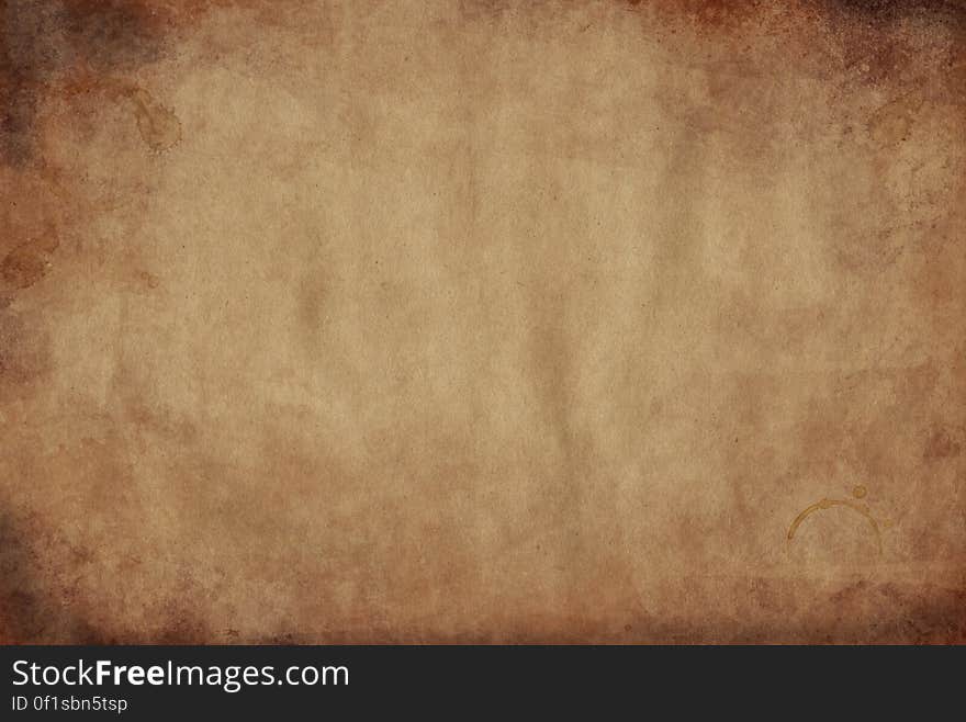 Abstract brown grunge textured parchment background with copy space. Abstract brown grunge textured parchment background with copy space.