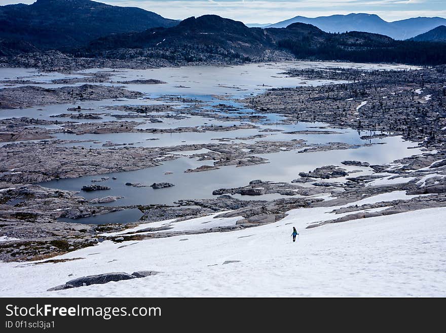 Person Walking on Snowy Field