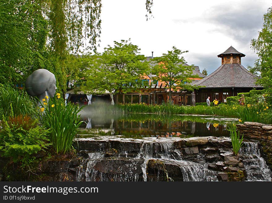 Zen garden including buildings, sculptures and waterfalls.