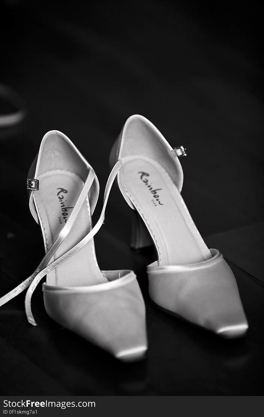 A pair of high heeled women's shoes with ankle strap and pointed toes. A pair of high heeled women's shoes with ankle strap and pointed toes.