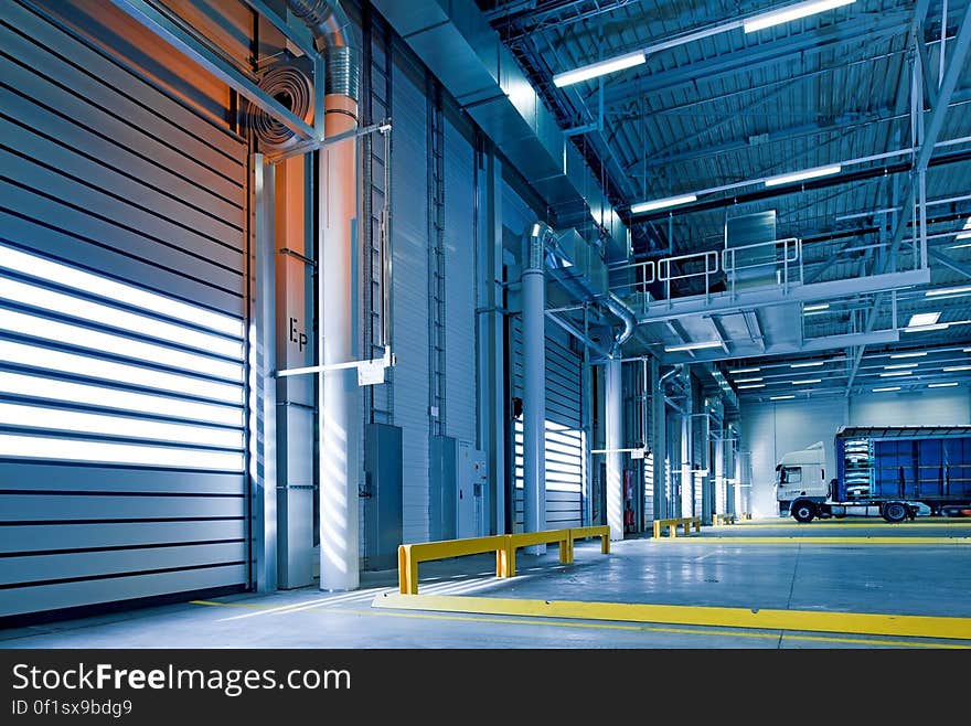 A car depot with large doors.