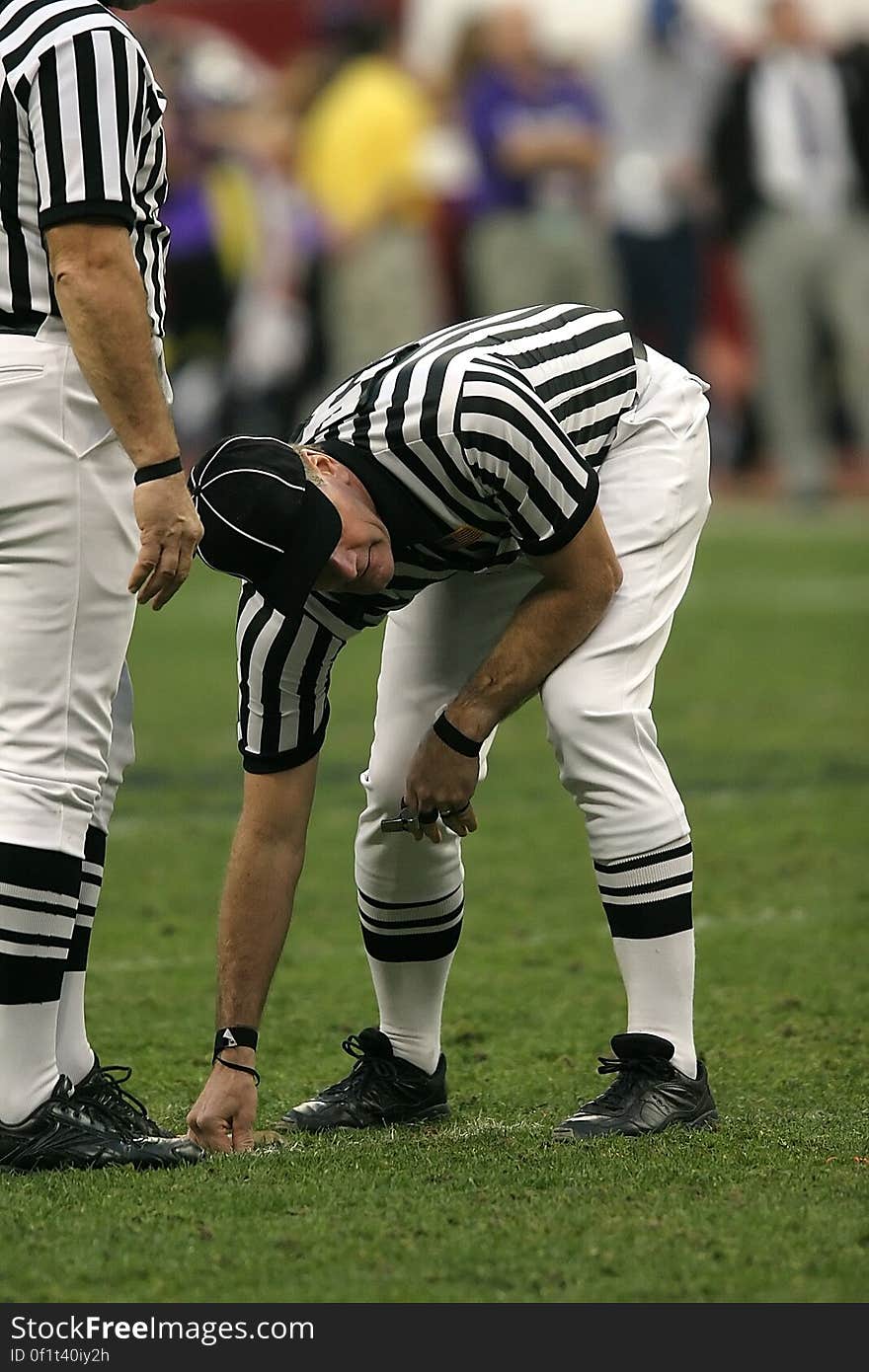 Person in Black and White Striped Uniform