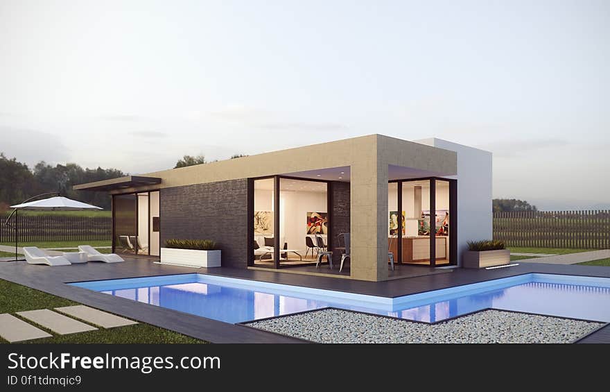 Exterior of modern designers home with swimming pool in countryside. Exterior of modern designers home with swimming pool in countryside.