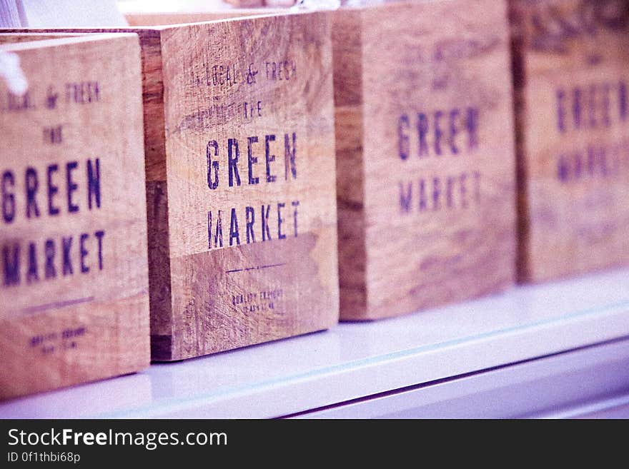 Row of vintage wooden boxes with the words green market.