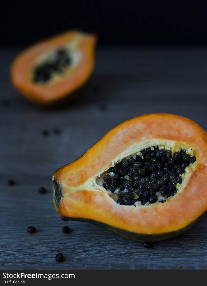 A close up of a halved papaya fruit.