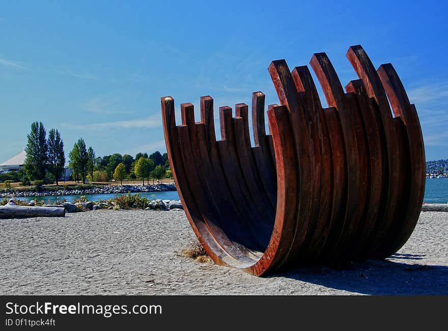 Bernar Venet&#x27;s sculpture, 217.5 Arc x 13&#x27;, in Sunset Beach Park - West End, Vancouver, British Columbia, Canada. Bernar Venet&#x27;s sculpture, 217.5 Arc x 13&#x27;, in Sunset Beach Park - West End, Vancouver, British Columbia, Canada