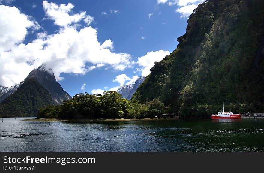 The pristine Milford Sound is part of the World Heritage Fiordland National Park, in the south west of the South Island, and is famed for its pristine natural beauty and remote atmosphere. It is New Zealandâ€™s best known fiord and the only one that can be reached by road. Maori are believed to have discovered Milford Sound more than 1,000 years ago, returning seasonally to collect the prized pounamu &#x28;greenstone&#x29;. The fiord extends 15km inland from the wild Tasman Sea and is regularly visited by wildlife including penguins, seals and dolphins. The pristine Milford Sound is part of the World Heritage Fiordland National Park, in the south west of the South Island, and is famed for its pristine natural beauty and remote atmosphere. It is New Zealandâ€™s best known fiord and the only one that can be reached by road. Maori are believed to have discovered Milford Sound more than 1,000 years ago, returning seasonally to collect the prized pounamu &#x28;greenstone&#x29;. The fiord extends 15km inland from the wild Tasman Sea and is regularly visited by wildlife including penguins, seals and dolphins.