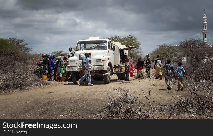 Burundian troops serving with the African Union Mission in Somalia &#x28;AMISOM&#x29; prepare a water truck to distribute fresh, potable drinking water in the village of Modmoday approx. 40km east of the central Somali town of Baidoa. The Burundians, together with forces of the Somali National Army &#x28;SNA&#x29; have been mounting &#x27;snap&#x27; foot patrols in villages and areas to the east of Baidoa where Al Qaeda-affiliated extremist group Al Shabaab mount attacks against local herdsmen, villages and travelers along the busy Baidoa-Mogadishu road. The AMISOM troops also use the patrols as an opportunity to provide occasional free medical treatment and drinking water for residents in the area. AU/UN IST PHOTO / ABDI DAKAN. Burundian troops serving with the African Union Mission in Somalia &#x28;AMISOM&#x29; prepare a water truck to distribute fresh, potable drinking water in the village of Modmoday approx. 40km east of the central Somali town of Baidoa. The Burundians, together with forces of the Somali National Army &#x28;SNA&#x29; have been mounting &#x27;snap&#x27; foot patrols in villages and areas to the east of Baidoa where Al Qaeda-affiliated extremist group Al Shabaab mount attacks against local herdsmen, villages and travelers along the busy Baidoa-Mogadishu road. The AMISOM troops also use the patrols as an opportunity to provide occasional free medical treatment and drinking water for residents in the area. AU/UN IST PHOTO / ABDI DAKAN.