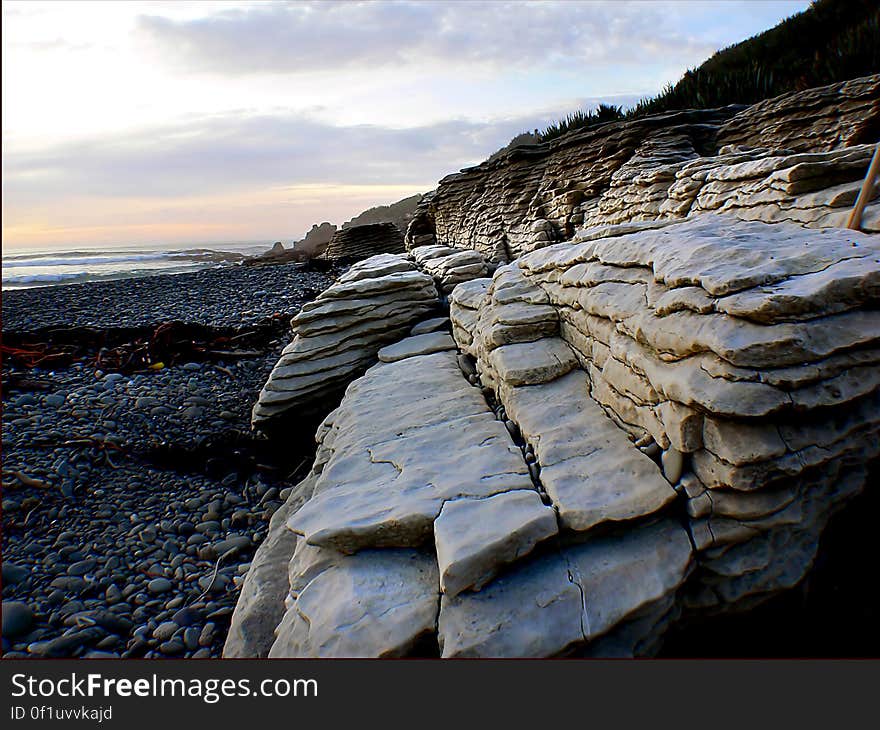 The Pancake Rocks that Punakaiki is famous for, are limestone formations that began forming 30 million years ago, when lime-rich fragments of dead marine creatures were deposited on the seabed, then overlaid by weaker layers of soft mud and clay. The Pancake Rocks that Punakaiki is famous for, are limestone formations that began forming 30 million years ago, when lime-rich fragments of dead marine creatures were deposited on the seabed, then overlaid by weaker layers of soft mud and clay.