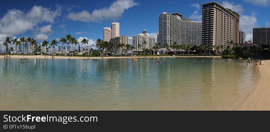 Kahanamoku Beach Waikiki, Oahu, Hawaii. This beach was named in the honor of Duke Paoa Kahanamoku who was a gold medal Olympic swimmer and credited with introducing surfing to the outside world. Kahanamoku Beach is bounded by the Ala Wai small boat harbor and the Hilton Hawaiian Village catamaran pier. A shallow offshore reef protects this beach from the big waves, making it a great swimming area for families with children. . Kahanamoku Beach Waikiki, Oahu, Hawaii. This beach was named in the honor of Duke Paoa Kahanamoku who was a gold medal Olympic swimmer and credited with introducing surfing to the outside world. Kahanamoku Beach is bounded by the Ala Wai small boat harbor and the Hilton Hawaiian Village catamaran pier. A shallow offshore reef protects this beach from the big waves, making it a great swimming area for families with children. .