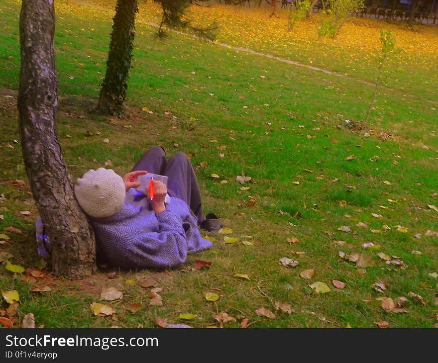 woman writing in the park