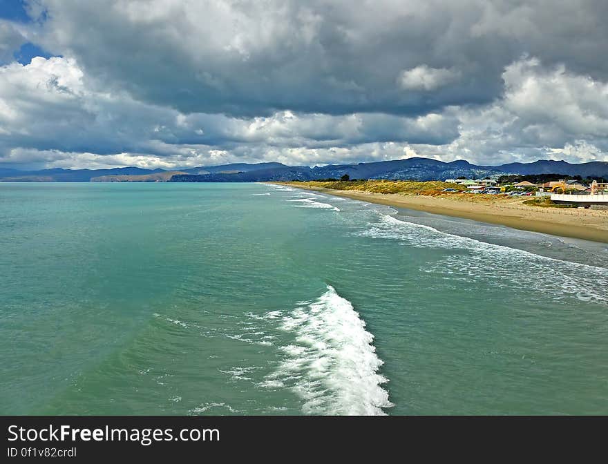 Christchurch New Zealand. A sandy beach, with good surfing, stretching 18 km from the Waimakariri River mouth in the north, to the Spit in the south. Christchurch New Zealand. A sandy beach, with good surfing, stretching 18 km from the Waimakariri River mouth in the north, to the Spit in the south.