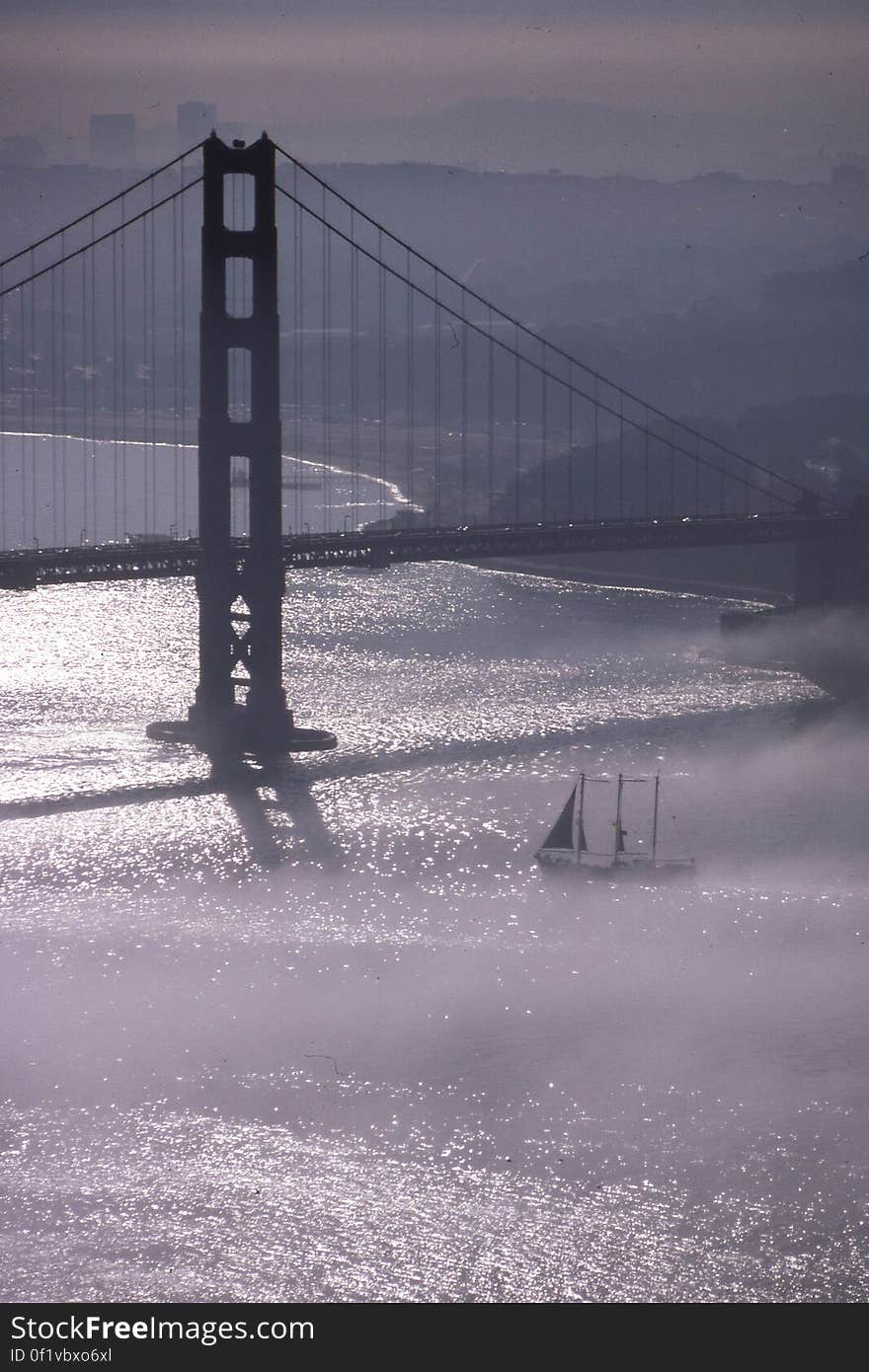 Golden Gate Bridge in fog 2 &#x28;with sailboat&#x29;