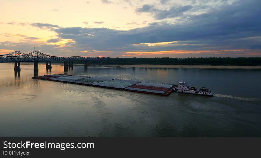 A barge tender prepares to pass under the Twin Bridges over the Mississippi River at Vicksburg, MS. A barge tender prepares to pass under the Twin Bridges over the Mississippi River at Vicksburg, MS.