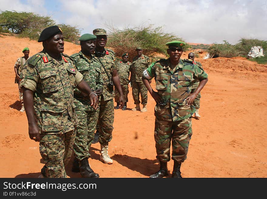 African soldiers in uniform standing in field on sunny day. African soldiers in uniform standing in field on sunny day.