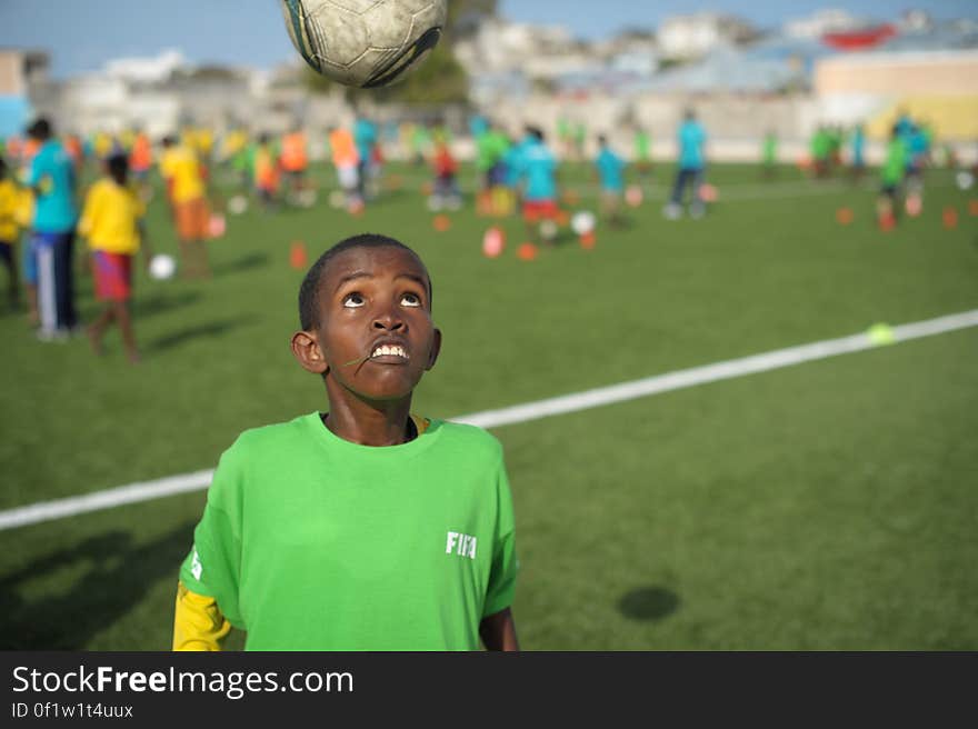 A child headers a ball during practice at the FIFA Football Festival in Mogadishu, Somalia, on August 19. FIFA, having had no presence in Somalia for the last 26 years, today held its first training session in Mogadishu since the country fell into civil war. Illegal under al Shabab, football has made a huge comeback in Somalia, with Mogadishu&#x27;s streets literally filling up with children each afternoon as they come out to play the game. AU UN IST PHOTO / TOBIN JONES. A child headers a ball during practice at the FIFA Football Festival in Mogadishu, Somalia, on August 19. FIFA, having had no presence in Somalia for the last 26 years, today held its first training session in Mogadishu since the country fell into civil war. Illegal under al Shabab, football has made a huge comeback in Somalia, with Mogadishu&#x27;s streets literally filling up with children each afternoon as they come out to play the game. AU UN IST PHOTO / TOBIN JONES.