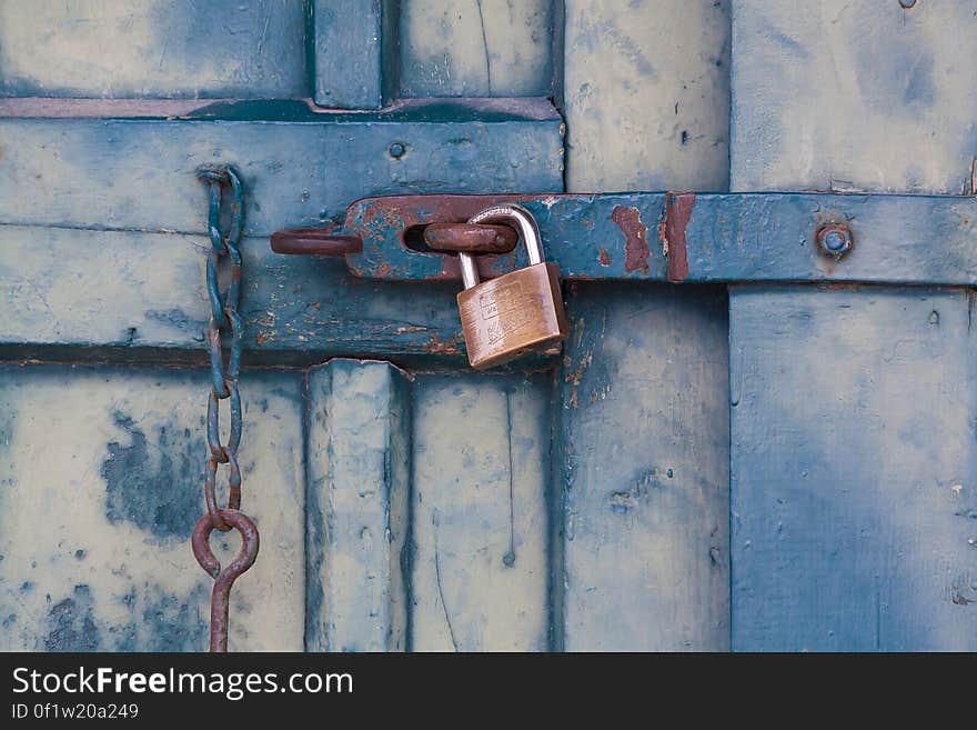 Gold Padlock Locking Door