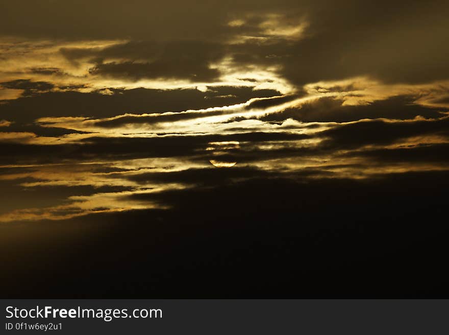 Dark sunset skies at golden hour. Dark sunset skies at golden hour.