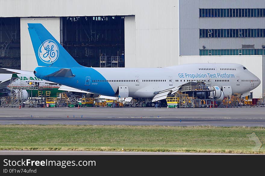 General Electric propulsion test platform airplane outside hanger at airport. General Electric propulsion test platform airplane outside hanger at airport.