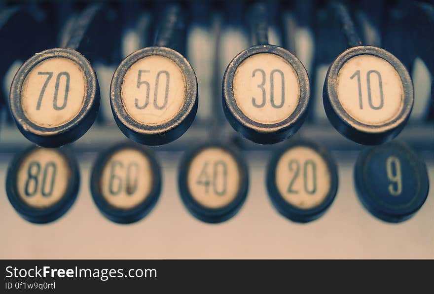 Closeup of vintage typewriter keys with numbers.