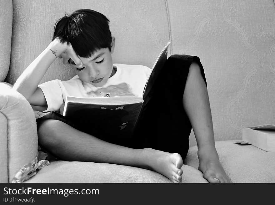 Rear View of Boy Sitting at Home